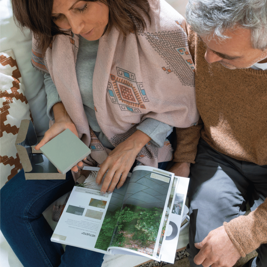 Couple looking at laying patterns in Bradstone brochure