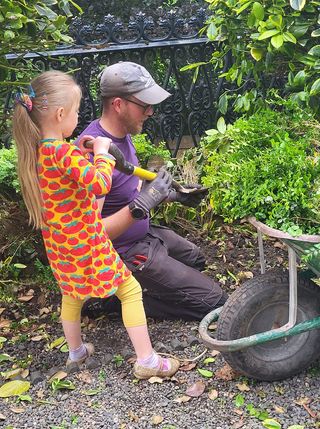 Phil and his daughter gardening